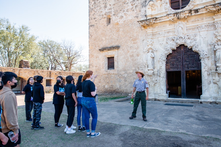 Elia Kruger, Park Ranger at San Antonio Missions National Historic Park, talks to students.
