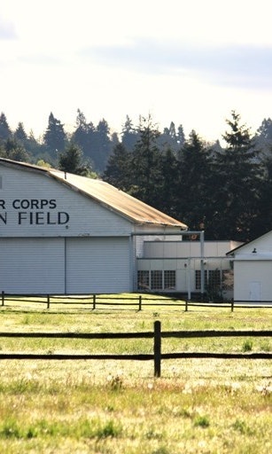 Covered air hangers. Letters on one read "Army Air Corps: Pearson Field"