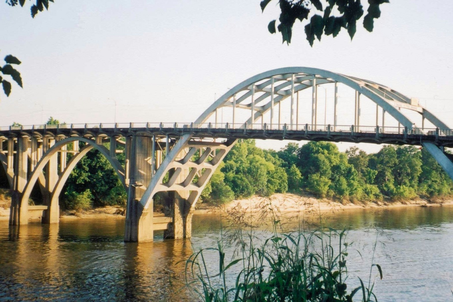 An arched steel bridge over a river