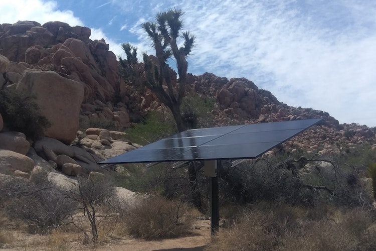 solar panels amid a desert landscape