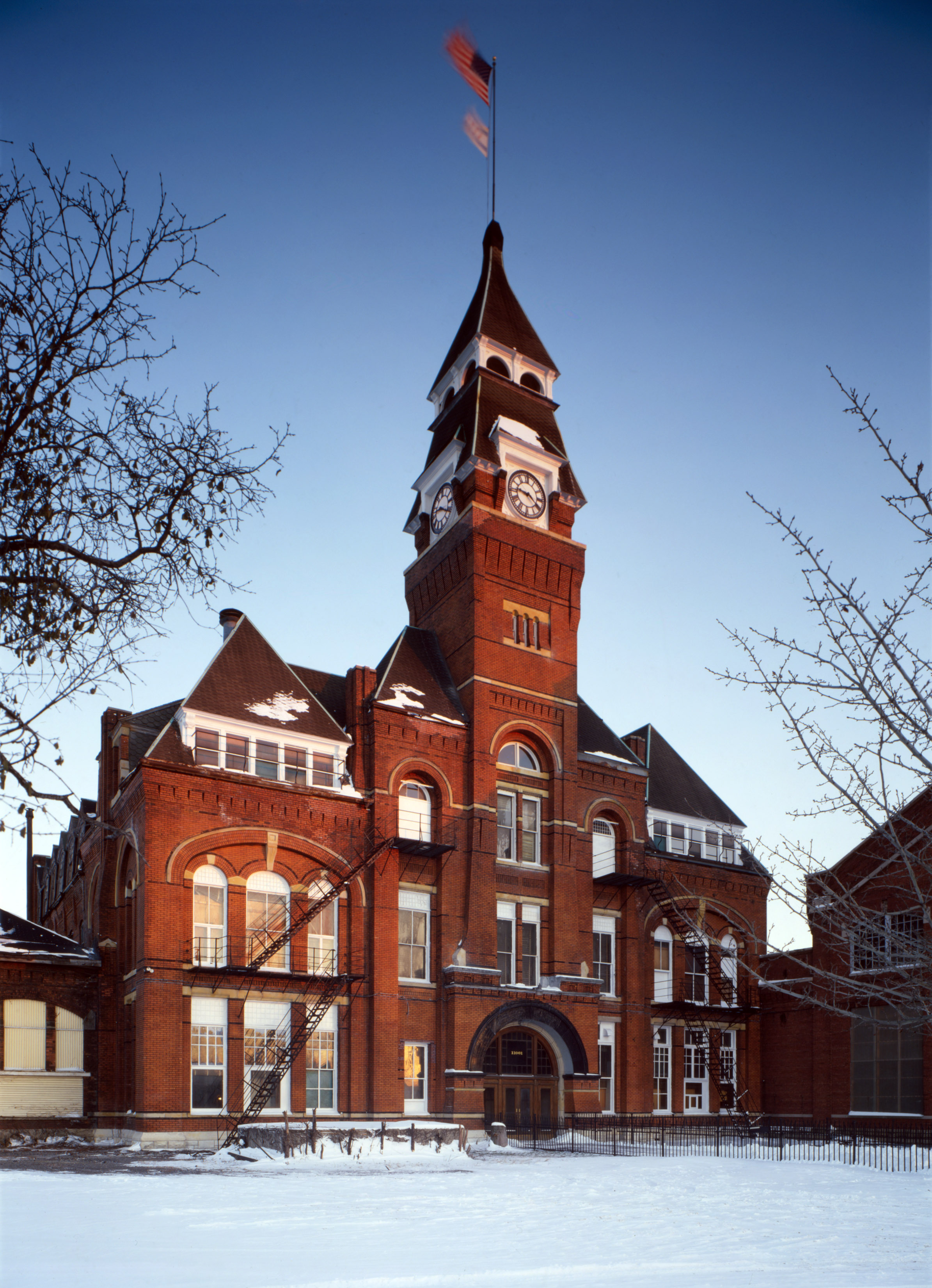 The facade of Pullman clocktower in the winter, with the ground covered in snow