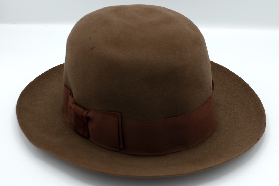 A brown, round top hat
