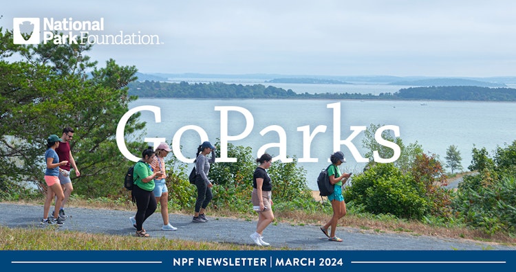 A group of people walking along a scenic view of Boston. Text reads: GoParks NPF Newsletter March 2024