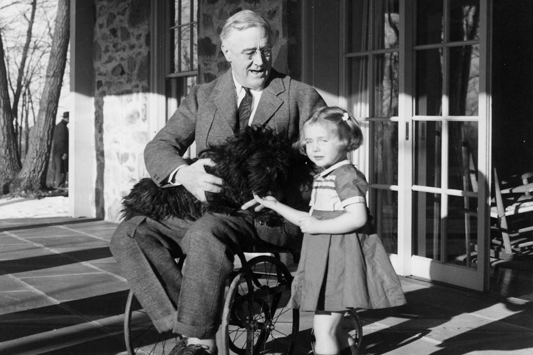 historic photo of Franklin D. Roosevelt with a young child
