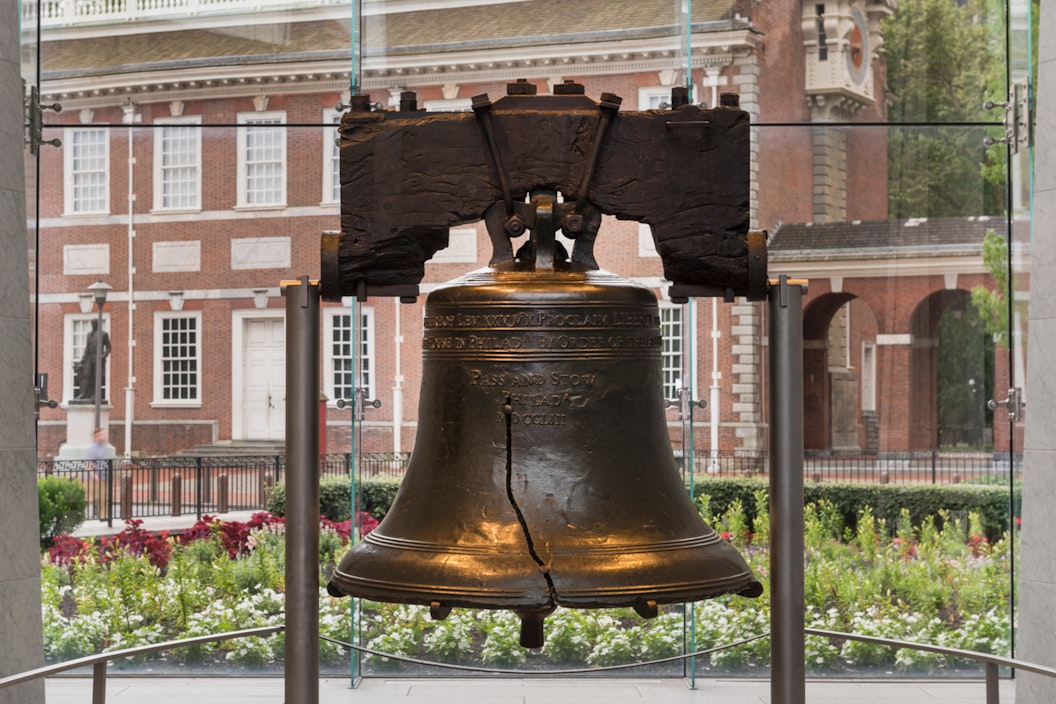 Liberty Bell, incased in a glass observatory, in front of Independence Hall