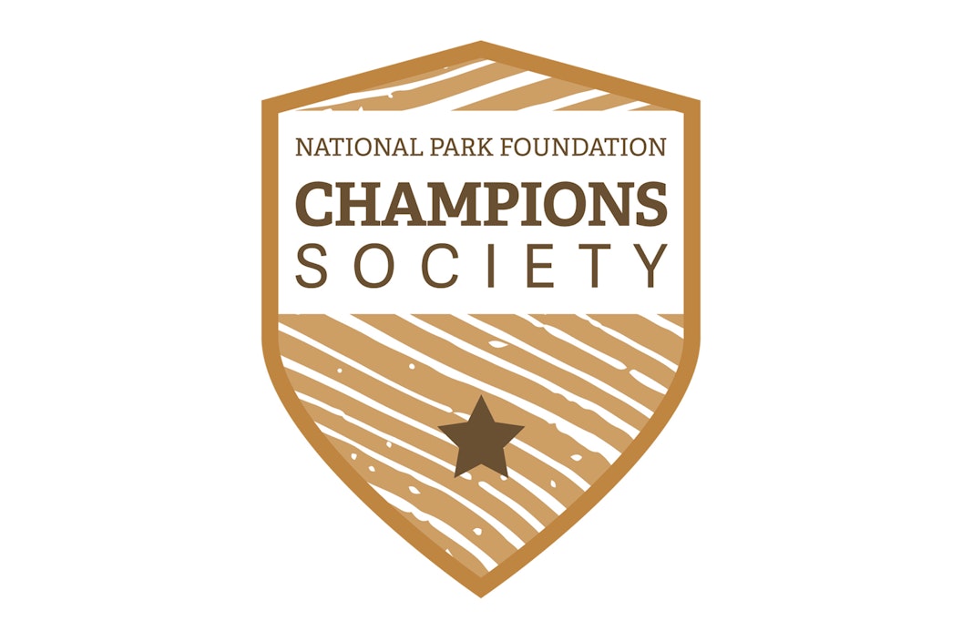 Illustration of a badge that reads "National Park Foundation, Champions Society" with a star