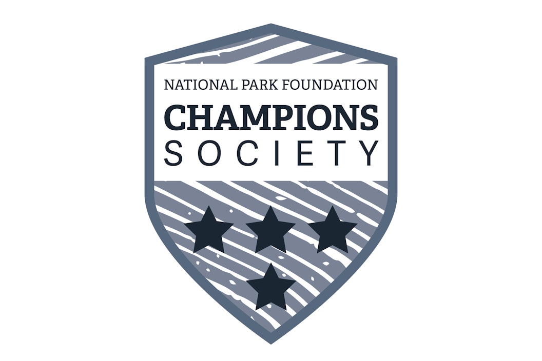 Illustration of a badge that reads "National Park Foundation, Champions Society" with 4 stars