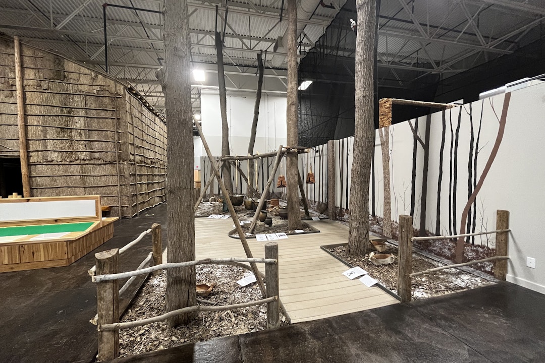 Indoors, an exhibit that mimics a forest is being constructed, including a wooden pathway through the exhibit