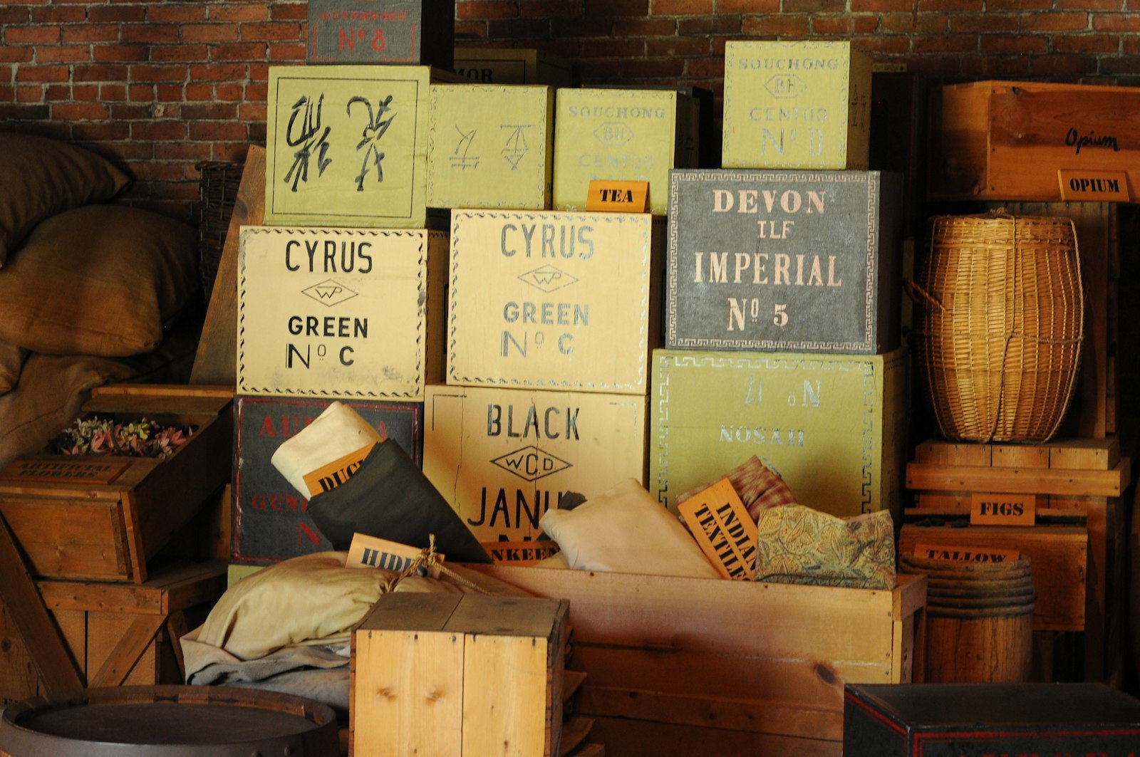 Exhibit of boxes, labeled things such as "Cypress Green" and "Devon Imperial"