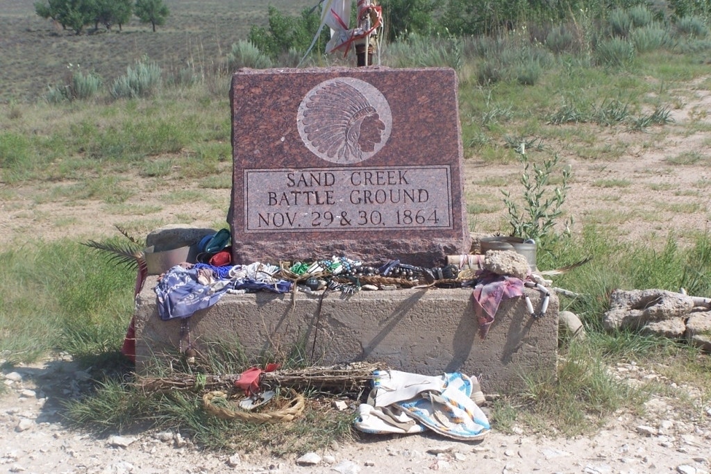 Stone marker that reads "Sand Creek Battle Ground: Nov 29 & 30, 1864"
