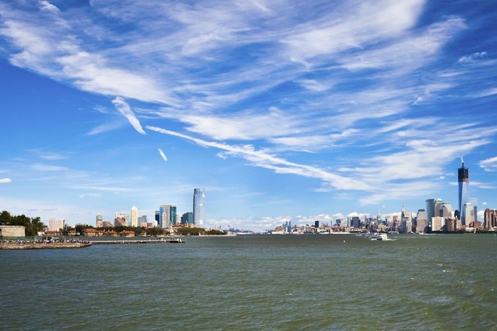 Across a bay, the New York City skyline
