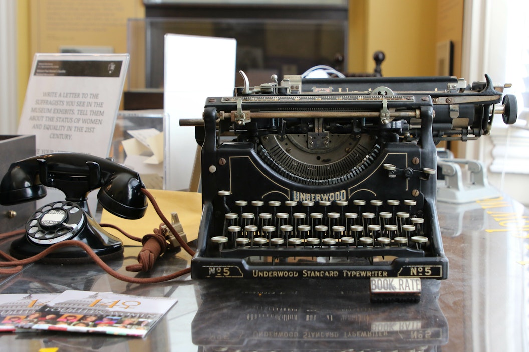 typewriter and phone on a desk