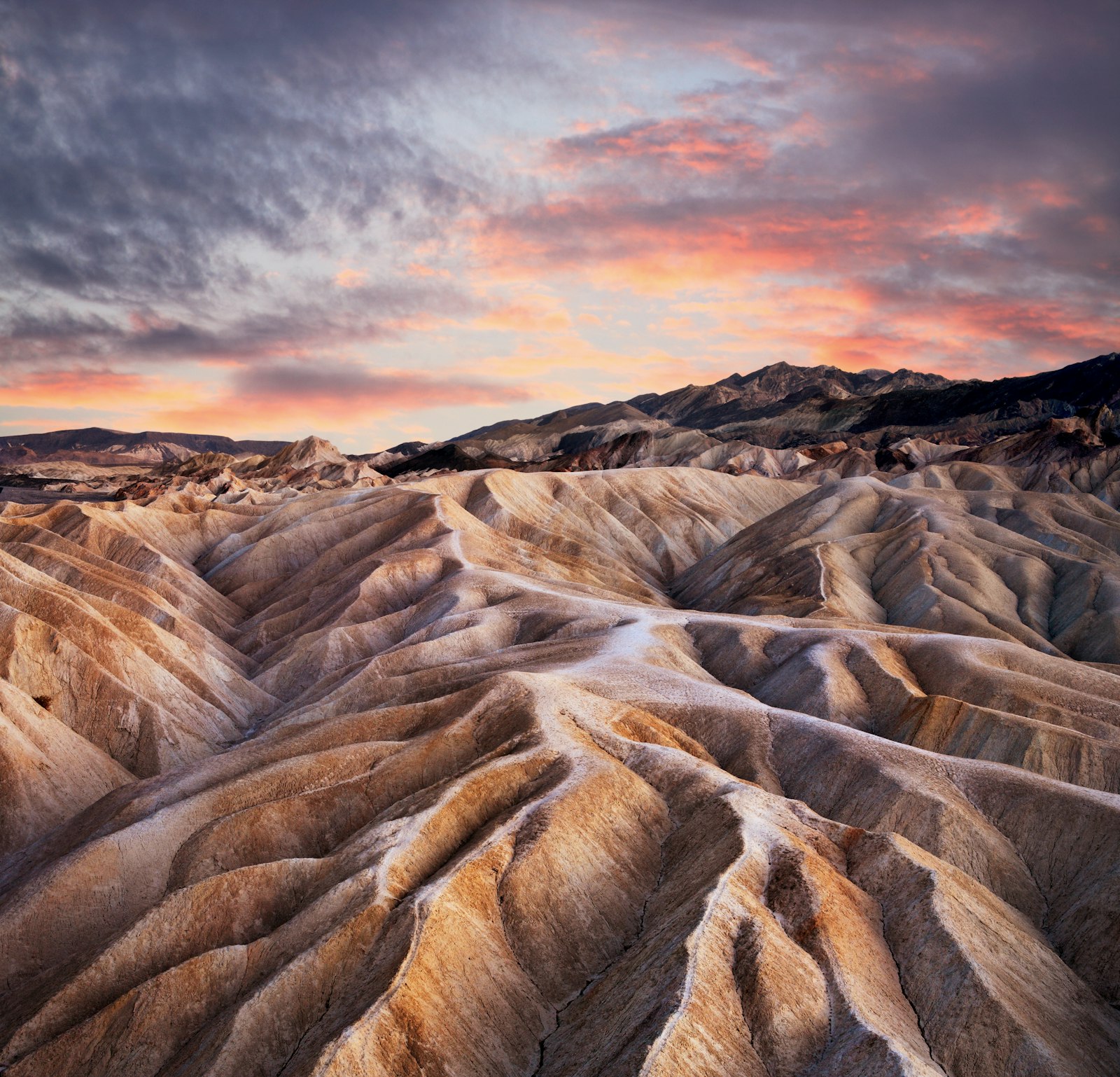 A sunset against the streaked dunes of Death Valley
