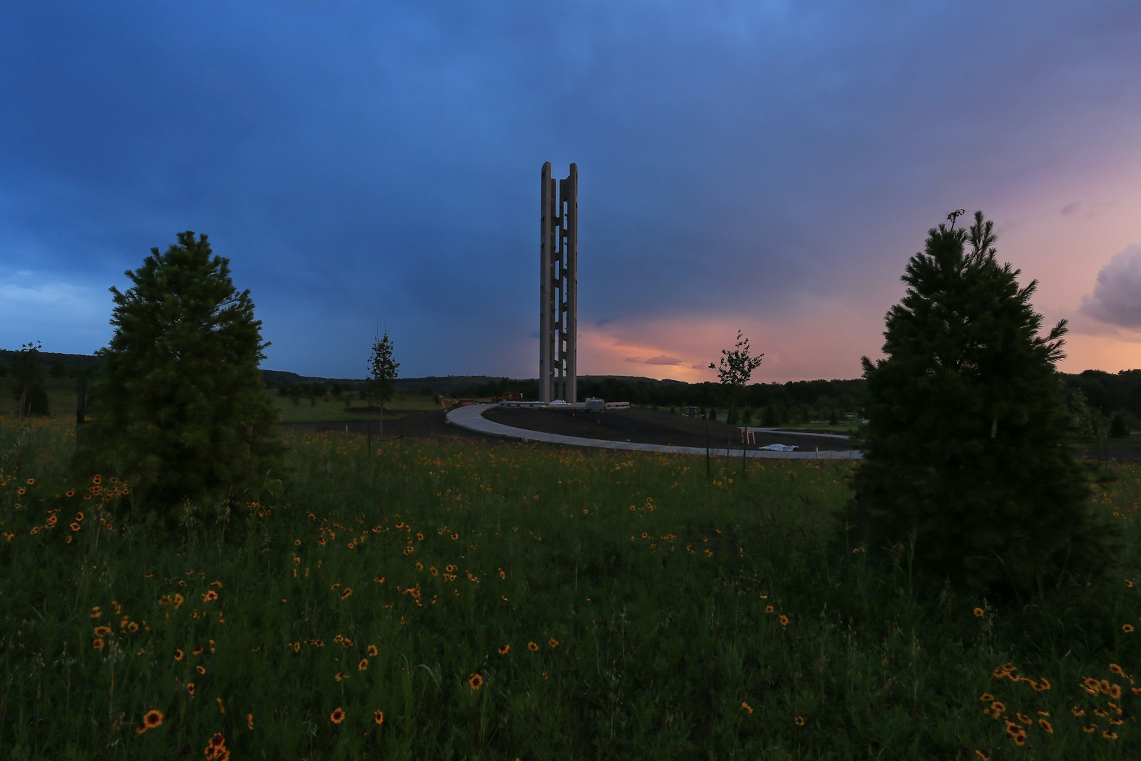 At sunset, a winding path that leads to an open tower structure