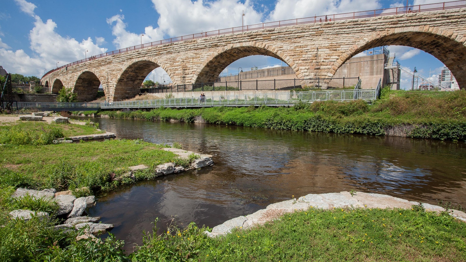 stone arched overpass along a river