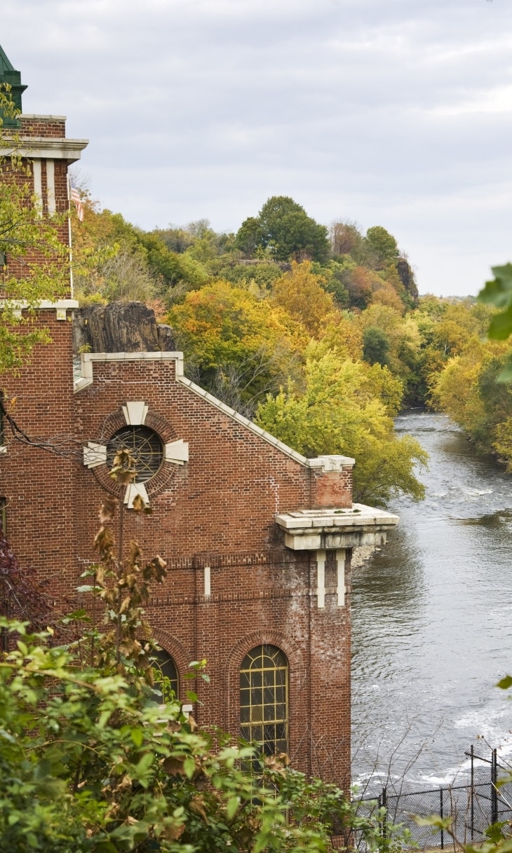Near waterfall, a power station building, built with red brick